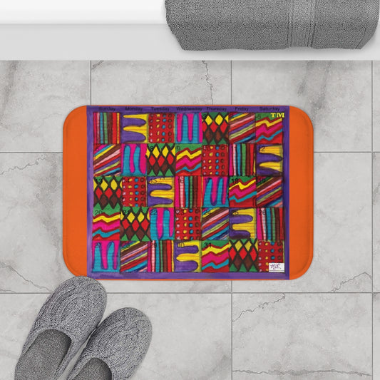 Bath Rug 24x17: "Psychedelic Calendar(tm)" - Vibrant - MiE Designs Shop. Orange surrounds centered month w/varied patterns.